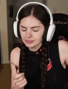 a woman wearing headphones with the word racer on the back