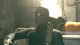 a man in a mask is holding a gun in a dark room