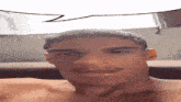a man without a shirt is smiling with a speech bubble above his head