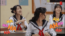 three girls in school uniforms are laughing in a classroom with free fire x written on the bottom