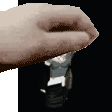 a pixelated image of a person 's hand holding a watch .