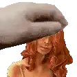 a woman with long red hair is being touched by a hand