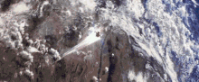 an aerial view of the earth with a few clouds