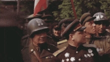 a group of soldiers wearing helmets with the letters np on them