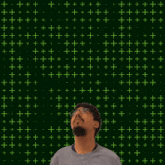 a man looking up at the number 19 with stars coming out of it