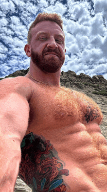 a man without a shirt has a tattoo on his side that says ' a '