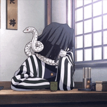 a cartoon character with a snake on his head