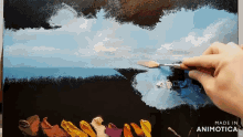a painting is being painted on a canvas with the words made in animotica below it