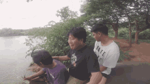 a man wearing a black shirt that says make life