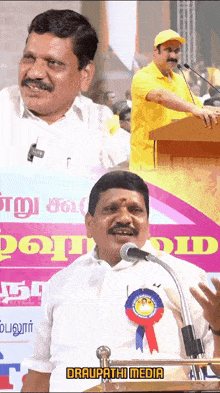 a man in a yellow shirt is speaking into a microphone in front of a sign that says ' draupathi media '