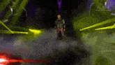 a man is standing on a stage with a sword in his hand