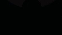 a person standing in front of a full moon with a sword in their hand