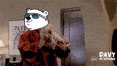a polar bear wearing sunglasses and a red robe is holding a piece of meat and says davy abc do nothing