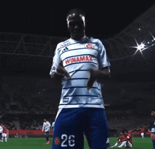 a soccer player wearing a shirt that says winamax
