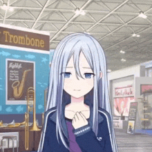 a girl with long white hair is standing in front of a trombone .