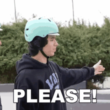 a man wearing a helmet and a hoodie with the word please below him