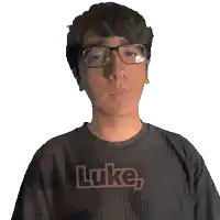 a man wearing glasses and a black shirt that says luke on it