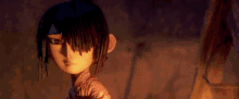 a close up of a cartoon character 's face in a dark room