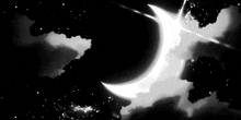 a black and white photo of a crescent moon