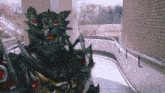 a black monster with red eyes is standing in a hallway