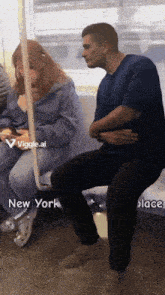 a man sits next to a woman on a subway train with the words new york place below him