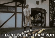 a man is standing next to a bunch of flowers with the words that 'll be about a 9 iron below him