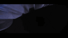 a dark background with the words the movie written on it