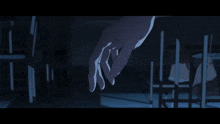 a man in a blue shirt is standing in a dark room with his arms outstretched