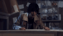 a person sitting in a chair in a room with a table and chairs