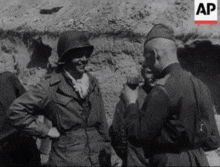 a black and white photo of a group of soldiers with the ap logo in the corner