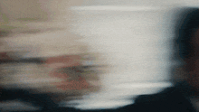 a blurry image of a person 's face with a few lines visible