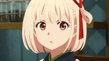 a girl with white hair and red eyes is looking at the camera