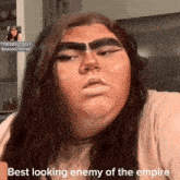 a woman with makeup on her face and the words best looking enemy of the empire