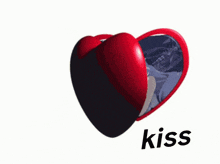 a heart shaped mirror with a picture of a girl and the word kiss on the bottom