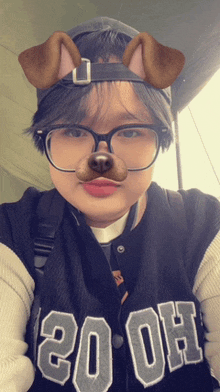 a person wearing glasses and a dog mask with the number 20 on their shirt