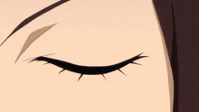a close up of a woman 's eye with a white pupil