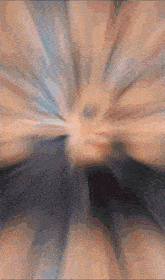 a blurry picture of a person 's face with a few lines of light coming out of it