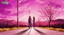 a man and a woman are walking down a road with a pink sky behind them