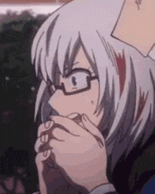 a close up of a person wearing glasses and a white haired anime character .