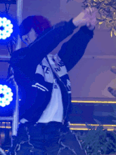 a person wearing a jacket that says state on it is dancing
