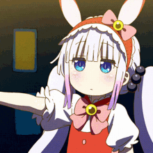 a girl with bunny ears and a bow on her head is wearing a red dress