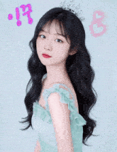 a girl wearing a green dress and a tiara with korean writing on the bottom