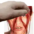 a close up of a woman 's face with a hat on .