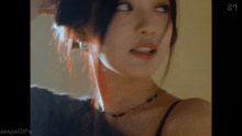 a close up of a woman 's face with the words " aespagifs " on the bottom