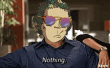 a man wearing sunglasses and a shirt that says nothing on it