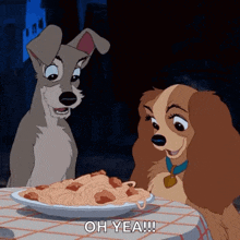 a couple of cartoon dogs sitting at a table with a plate of spaghetti