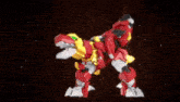 a red and black robot with yellow wings is being destroyed by a black background .