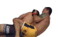 two men are wrestling with one wearing shorts that say abdallah
