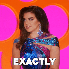 a woman in a blue and pink dress is standing in front of a pink background that says exactly
