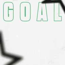 a green goal goal sign with arrows pointing to it